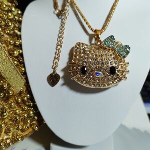 Betsey Johnson Gold Hello Kitty Necklace with Blue Bow
